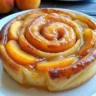 Freshly baked peach pie cinnamon rolls Gooey cinnamon rolls with peach filling Homemade peach cinnamon rolls
