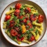 Roasted Tomatoes Pesto Pasta - Sweet roasted tomatoes meet fresh basil pesto in this easy 30-minute dinner!