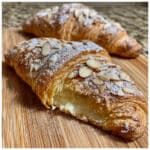 almond croissant filling with smooth, spreadable texture next to sliced croissants and scattered sliced almonds