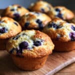 Moist Blueberry Sour Cream Muffins with bakery-style domes in just 30 minutes! Full-fat sour cream creates an incredibly tender crumb
