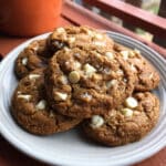 Stack of brown butter dirty chai cookies with white chocolate chips showing chewy texture and golden brown edges