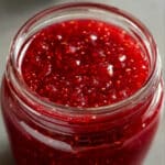 Homemade raspberry cake filling with fresh berry flavor perfect for layering between vanilla or white chocolate cakes